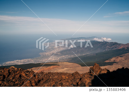 City and Atlantic Ocean View from Mount Teide Volcano in South Tenerife, Spain 135883406