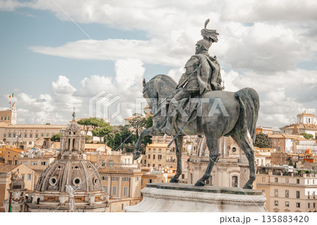 Vittorio Emanuele Equestrian statue Overlooking Historic Skyline on Bright Day 135883420