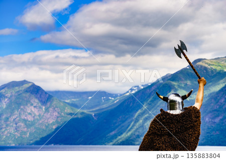 Viking warrior on fjord shore, Norway 135883804