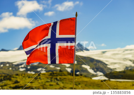 Norwegian flag and mountains snowy landscape Norwegian flag and mountains snowy landscape 135883856