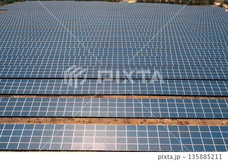 Large solar power plant with endless rows of 135885211