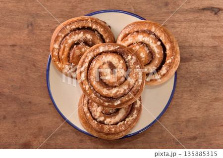 Freshly baked cinnamon roll Freshly baked cinnamon roll 135885315