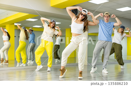 Young girl in sunglasses dancing modern dance Young girl in sunglasses dancing modern dance 135886210