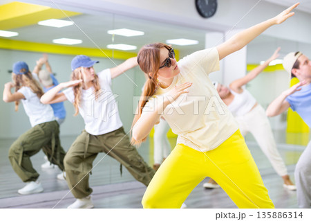 Teen girl dancing modern dances in dance studio 135886314