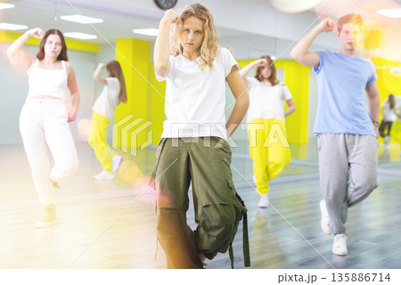 Teen girl in wide pants dancing hip hop Teen girl in wide pants dancing hip hop 135886714