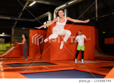 Woman sportswoman fitness jumping on club trampoline 135886744