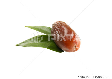 Sweet and nutritious date resting on green leaves, isolated, PNG Sweet and nutritious date resting on green leaves, isolated, PNG 135886828