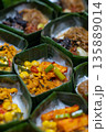 Indonesian Rice Meals Wrapped in Banana Leaf 135889014