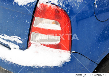 Detailed shot of frosted automotive tail light exhibiting seasonal weather effects 135890747