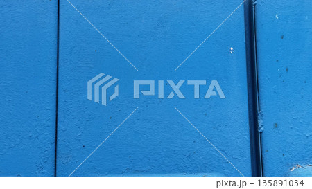 Close-up of a textured blue wall ideal for backgrounds. Close-up of a textured blue wall ideal for backgrounds. 135891034