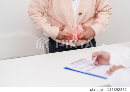 Elderly woman Patient consultation with doctor for Colon disease, Large Intestine, Colorectal cancer, Ulcerative colitis, Diverticulitis, Irritable bowel syndrome, Digestive system and Healthcare 135892251