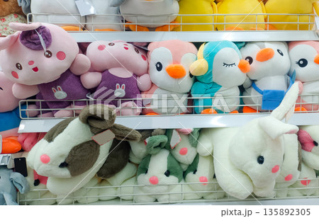 Cute Penguin and Bunny Stuffed Animals on Store Shelves Cute Penguin and Bunny Stuffed Animals on Store Shelves 135892305
