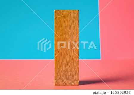 Simple wooden block stands against colorful background in minimalistic design 135892927