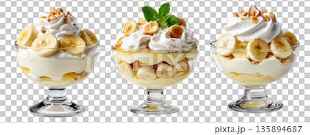 Banana pudding dessert with whipped cream and mint leaves in glass cup, isolated on white background, concept of sweet treat 135894687