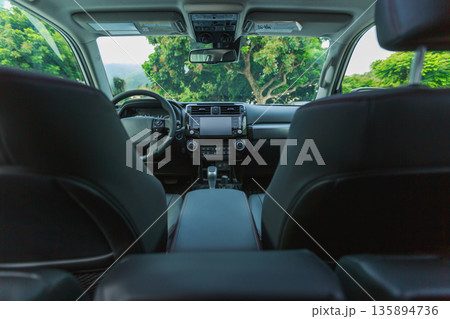 Interior of new off road car in forest mountains 135894736