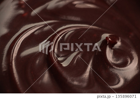 Glossy dark chocolate surface macro texture Glossy dark chocolate surface macro texture 135896071