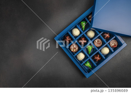 Luxury assorted chocolate pralines in blue gift box with copy space Luxury assorted chocolate pralines in blue gift box with copy space 135896089