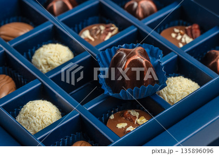 Luxury assorted chocolate candies in blue box, close up view 135896096