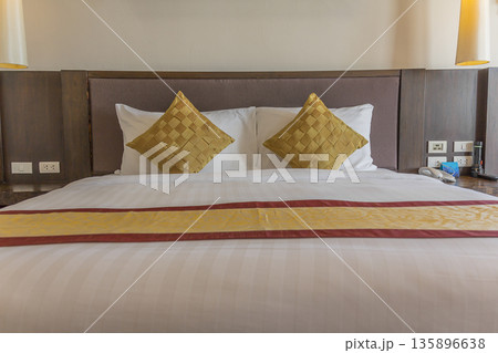 White pillows on bed in bedroom White pillows on bed in bedroom 135896638