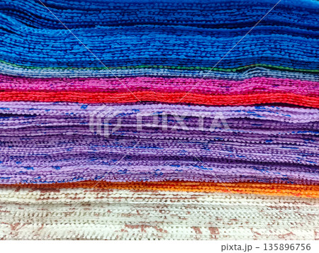 Stack of Colorful Microfiber and Textured Cleaning Cloths 135896756