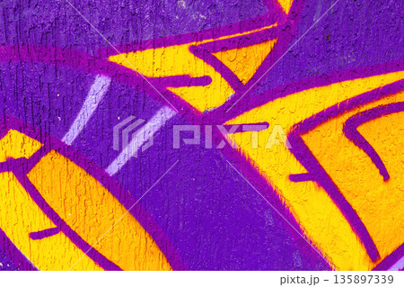 Abstract Graffiti with Yellow and Purple Shapes on Textured Wall for Urban 90s, Y2K Street Art Abstract Graffiti with Yellow and Purple Shapes on Textured Wall for Urban 90s, Y2K Street Art 135897339
