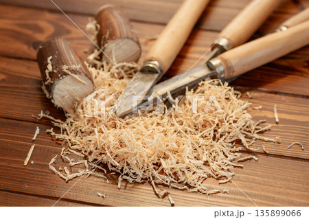 Carpentry tool set with wood shavings on wooden table Carpentry tool set with wood shavings on wooden table 135899066