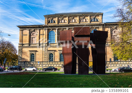 Munich, Germany - Nov 05, 2025: Old Pinakothek museum with the abstract sculpture Buscando la Luz in front Munich, Germany - Nov 05, 2025: Old Pinakothek museum with the abstract sculpture Buscando la Luz in front 135899101