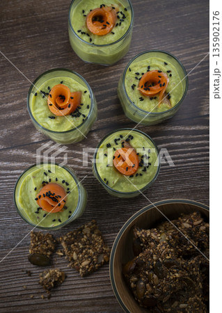 Smoked salmon shot glasses guacamole served with homemade crackers Smoked salmon shot glasses guacamole served with homemade crackers 135902176