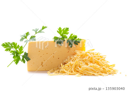 Dairy product with grated cheese pile and parsley leaf Dairy product with grated cheese pile and parsley leaf 135903040