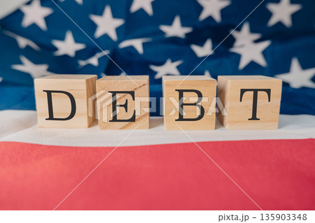 Wooden block with the word debt written on it 135903348