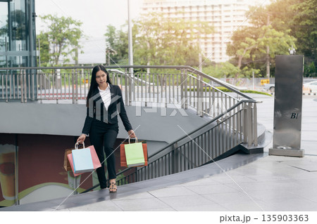 Happy woman with shopping bags enjoying in shopping. Happy woman with shopping bags enjoying in shopping. 135903363