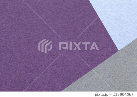 Violet textured paper background with light blue gray triangular corners and copy space. Template for presentation, banner 135904067