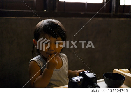 Toddler Is Playing With A Camera, Background for advertising and wallpaper in education and lifestyle scene. 135904746