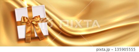 Golden silk background, white gift box, satin ribbon 135905555