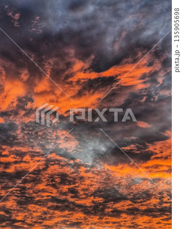 Dramatic Sunrise Clouds. Fiery Sky at Dawn. Orange and Blue Sky Panorama. Colorful Cloudscape 135905698