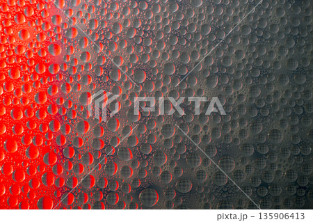 A background of a huge number of water droplets on glass A background of a huge number of water droplets on glass 135906413