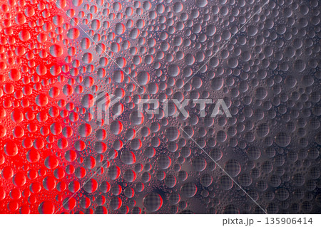 A background of a huge number of water droplets on glass A background of a huge number of water droplets on glass 135906414