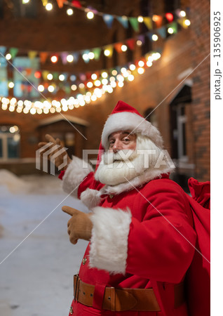 Portrait of Santa Claus in the dark with lights.  135906925