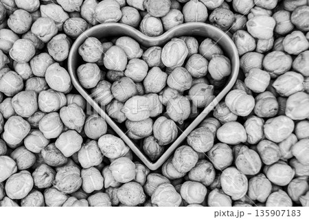 Beautiful organic dried chickpea beans consisting of raw bengal legume pea 135907183