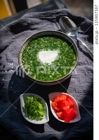 Traditional Russian lunch in a cafe. Top view of okroshka. Traditional Russian lunch in a cafe. Top view of okroshka. 135907387
