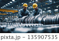 Workers assemble turbine parts in a factory on a busy day 135907535