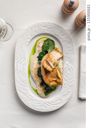 Pan seared white fish with creamy sauce Pan seared white fish with creamy sauce 135908881
