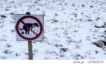 No Dogs Allowed Sign in Snowy Landscape for Pet Owners 135909579