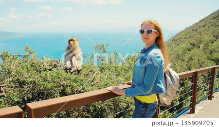 Woman tourist and macaque monkey. Gibraltar 135909705