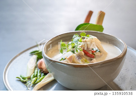 Close up to Coconut milk with chicken soup, Delicious Thai Menu are shot in studio light. Close up to Coconut milk with chicken soup, Delicious Thai Menu are shot in studio light. 135910538