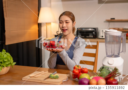 Fit woman enjoys healthy fruit breakfast after yoga training. fitness, nutrition, healthy lifestyle. Fit woman enjoys healthy fruit breakfast after yoga training. fitness, nutrition, healthy lifestyle. 135911892