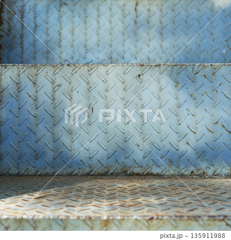 Aged blue industrial metal wall with embossed oval patterns, weathered rust grunge wall Aged blue industrial metal wall with embossed oval patterns, weathered rust grunge wall 135911988