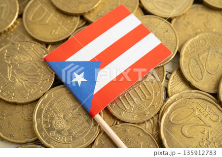 Puerto Rico flag on coins background for finance banking business. Puerto Rico flag on coins background for finance banking business. 135912783