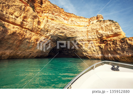 Coastal rocky seascape, view of Praia da Marinha beach and Benagil in the Algarve region in the Atlantic Ocean, Portugal, Europe. Boat excursion along the coast 135912880