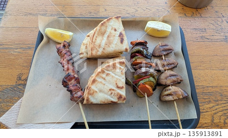 Souvlaki, Greek skewers with pita bread and lemon Souvlaki, Greek skewers with pita bread and lemon 135913891
